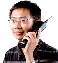 Chinese Man Talking On His Motorola Dynatec 8000x